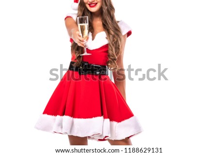 cropped view of woman in santa costume holding champagne glass, isolated on white