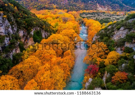 Aerial view of the Old stone bridge in Klidonia Zagoria in the autumn, Epirus, Western Greece. This arch bridge with elongated arch built in 1853. Royalty-Free Stock Photo #1188663136