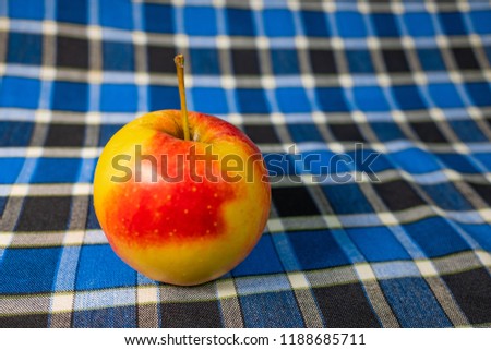 apples on a blue background, blue checkered background, yellow and red apples, series, wallpaper, background,