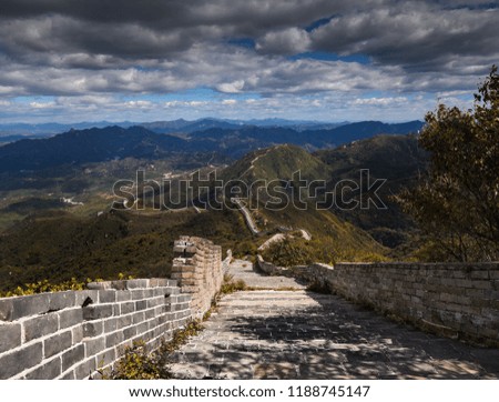 The Great Wall of China sneaking through the mountainous landscape. One of the greatest pieces of architecture ever build by man. 