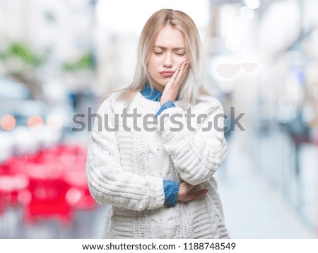 Young blonde woman wearing winter sweater over isolated background thinking looking tired and bored with depression problems with crossed arms.