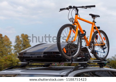Transportation of bicycles on the roof of the car. Concept: a car trip with a bike Royalty-Free Stock Photo #1188751423