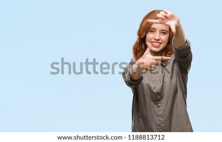 Young beautiful woman over isolated background smiling making frame with hands and fingers with happy face. Creativity and photography concept.