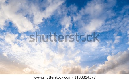 Blue sky background or Beautiful blue sky The white clouds cover the full sky. Sunlight reflected in the evening.