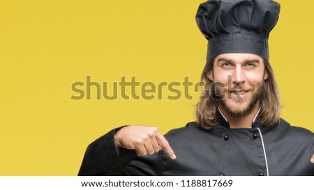 Young handsome cook man with long hair over isolated background looking confident with smile on face, pointing oneself with fingers proud and happy.