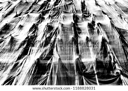 Construction site wall fence, covered with sand net perspective, black and white
