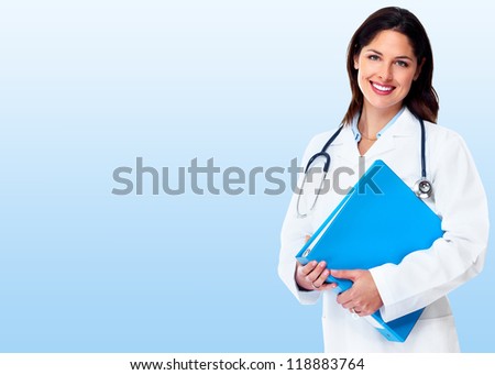 Smiling medical doctor woman. Over blue Health care background.
