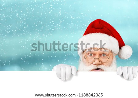 Happy Santa Claus holding blank