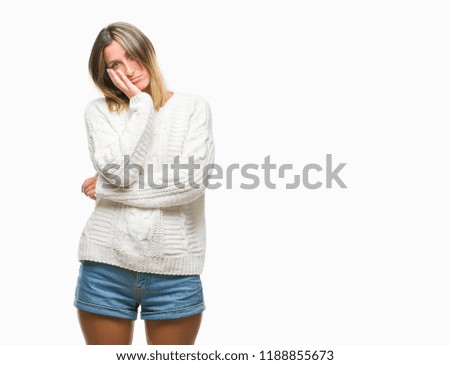 Young beautiful woman wearing winter sweater over isolated background thinking looking tired and bored with depression problems with crossed arms.