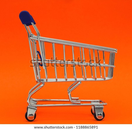 Shopping cart on red background