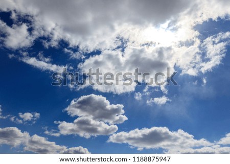 White clouds against blue sky as background