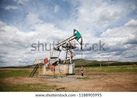 The machine tool for an oil recovery in a summer landscape