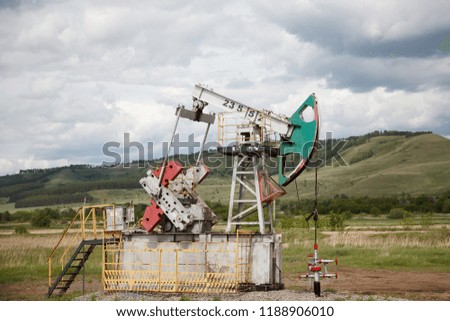 The machine tool for an oil recovery in a summer landscape