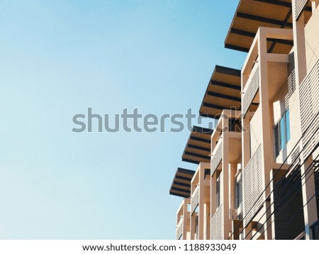 Modern commercial building in the city. Building is facing sunlight.