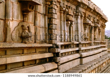Ornate design on side walls of Hampi temple