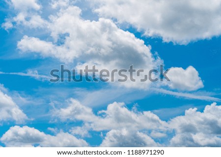 Blue sky with clouds on day with sunshine