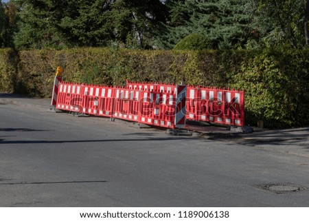 Red barrier at the side of the street