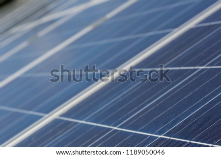 Detail of solar panel for eco friendly production of electric energy as green alternative to use fossil fuel as main generator of greenhouse gas. Background blur empty space photography for desktop.