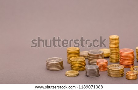 Coins Money US dollars and Euros on a gray background, different monetary coins