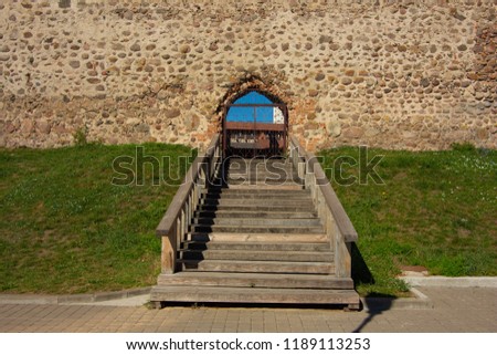 wooden staircases and handrails to the doors of the ancient castle