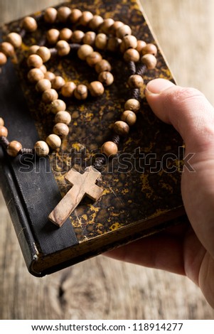 the holy bible and rosary beads