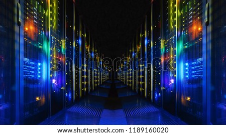 Shot of Corridor in Large Working Data Center Full of Rack Servers and Supercomputers. Royalty-Free Stock Photo #1189160020