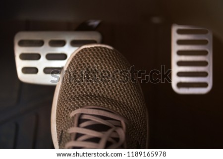 Stop car theme. Shoe press break car pedal Royalty-Free Stock Photo #1189165978