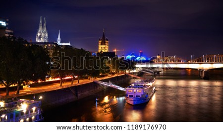 View of Cologne Dom Cathedral and Great St Martin Church at night 