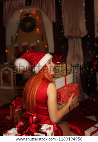 Cheerful girl with Christmas gifts