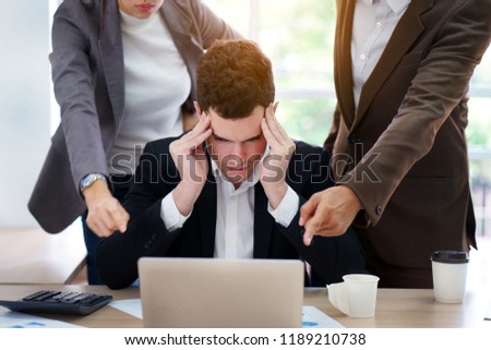 Stressed Caucasian businessman getting trouble from mistake. Corporate colleague pushing new business project planning. Teamwork planners have conflict of interest between partner and coworker  Royalty-Free Stock Photo #1189210738