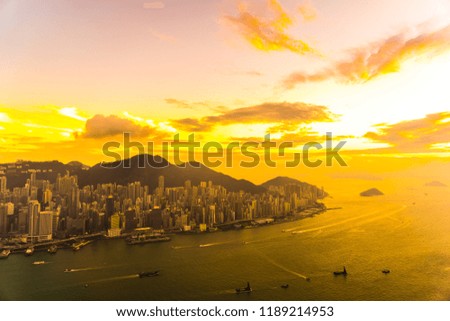Beautiful colorful sunset in hong kong city skyline with sea and ocean bay