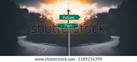 Two way junction with "past and present" sign in the middle. Meant to symbolize moving on and not looking a the past Royalty-Free Stock Photo #1189216390