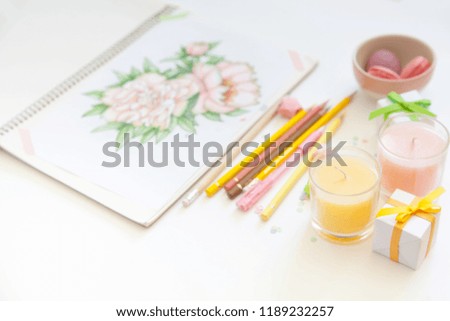 concept of women's hobbies and leisure. drawing with simple colored pencils