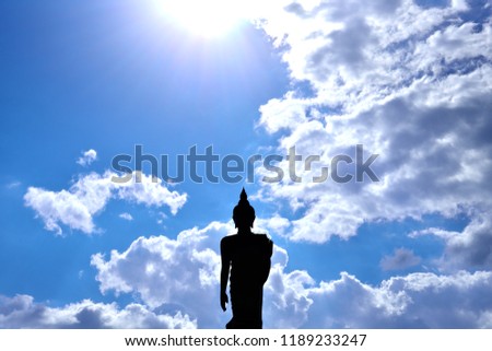 buddha statue on sunshine blue sky
