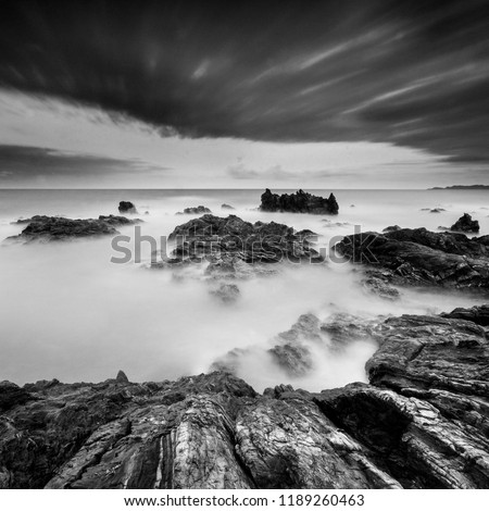 Beautiful long exposure seascape rocks in black and white. Nature composition.