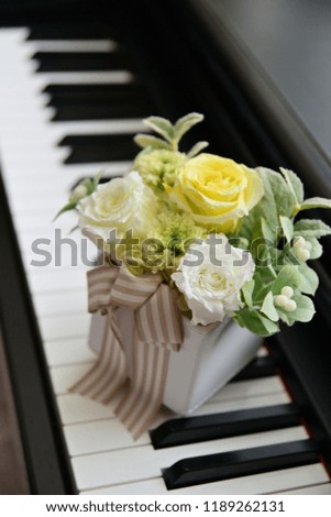 preserved flower on piano