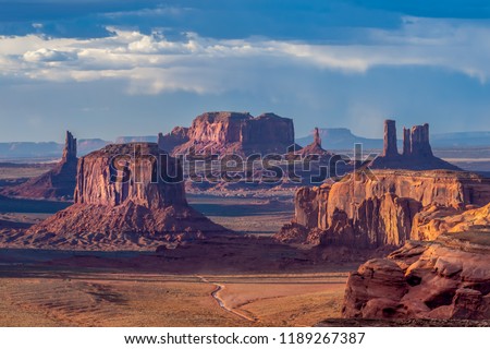 Dramatic views of Monument Valley in Navajo Nation with golden light at sunset 
 Royalty-Free Stock Photo #1189267387
