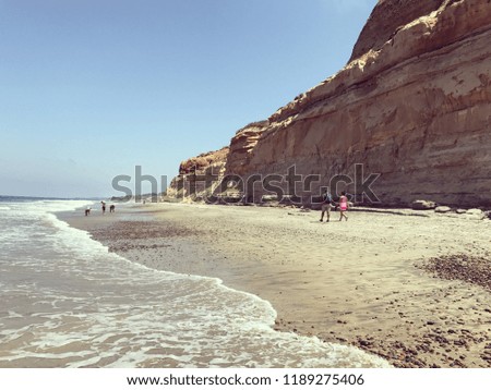 beautiful landscape of a beach with cliffs