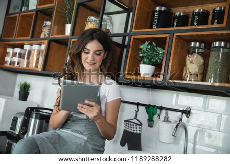 beautiful woman cafe worker standing in her coffee shop