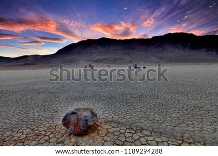 'Sailing Stone' at the Racetrack Playa on sunset background in Death Valley National Park, California USA.the traveler photographs the famous moving rocks on the Racetrack playa.