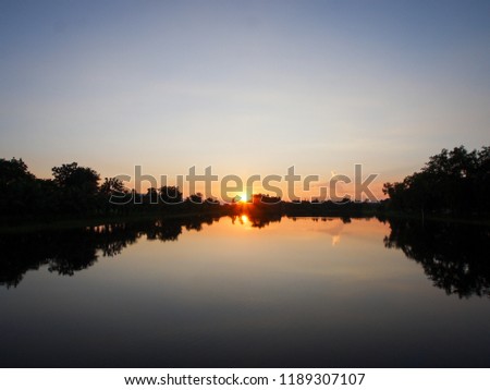 Clouds and sky at sunset, water reflection