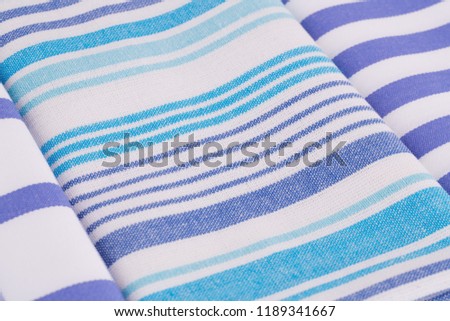 Blue and white kitchen towels closeup picture.