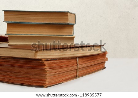 collection of old worn books on white