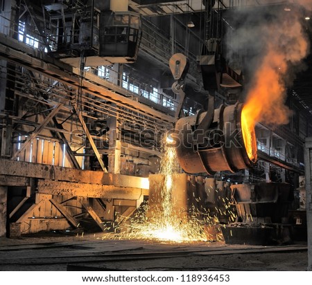 smelting of the metal in the foundry Royalty-Free Stock Photo #118936453