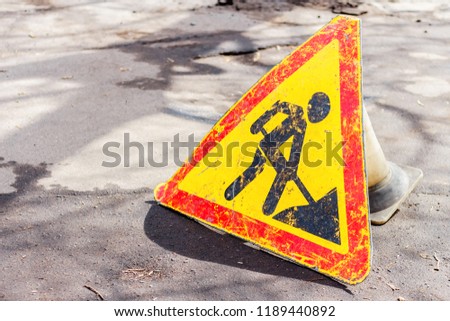 Road works are under way. Sign on a road with copyspace