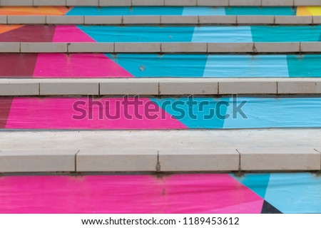 front view of Stair with steps painted colorful. Royalty-Free Stock Photo #1189453612