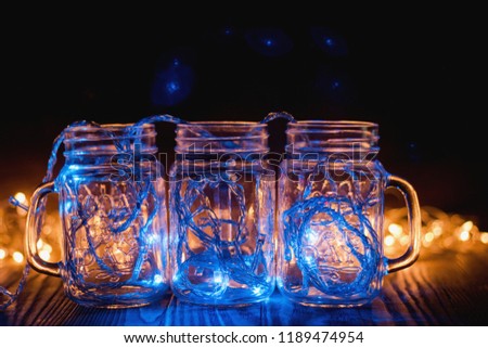 colorful lights in a glass transparent jars Christmas lights in the room.
