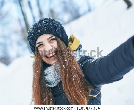 a Beautiful young woman in winter outside