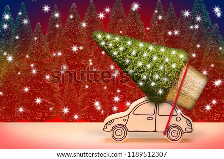 Christmas holiday concept with a small pine tree on handmade cartoon toy car