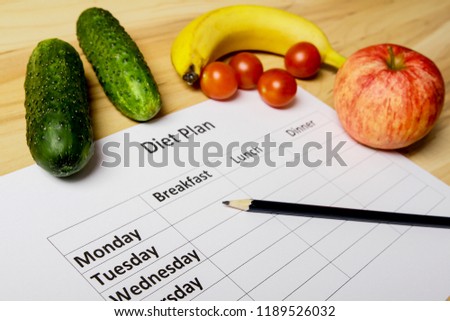 Sheet of Diet Plan and fresh products on wooden table, top view
